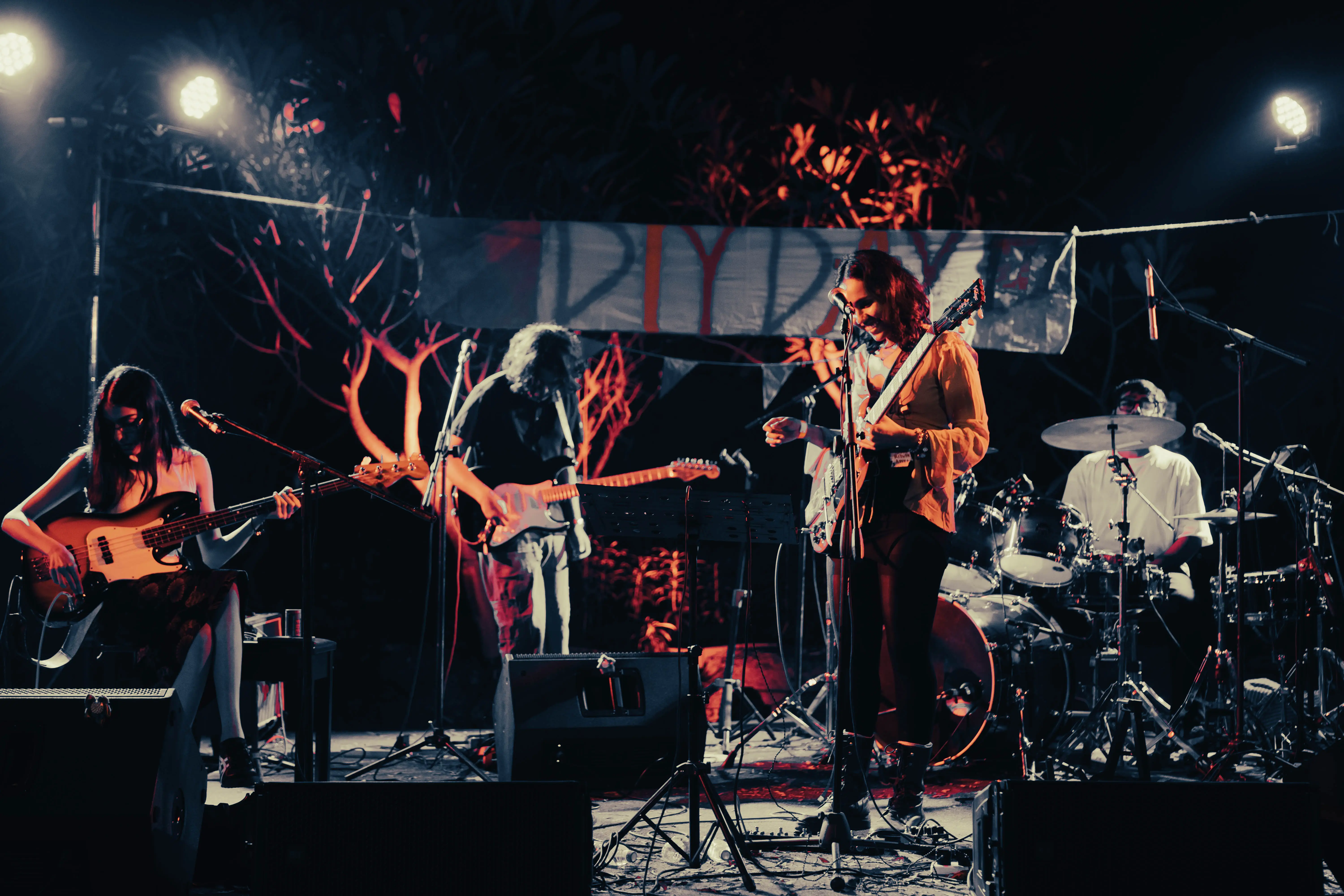 Salt Rock playing under a hand-painted DIY banner
